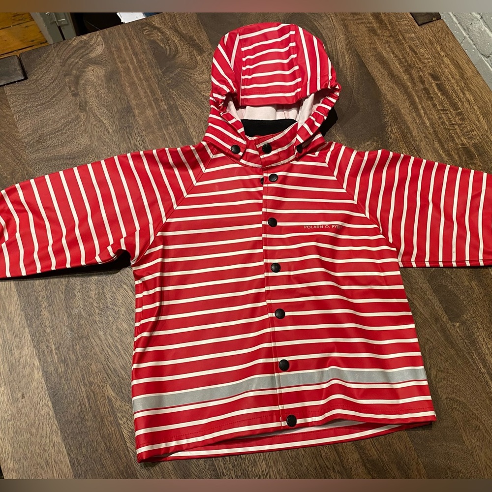 Swedish clothing brand Polarn O. Pyret red and white striped raincoat.